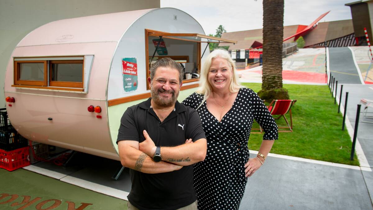 The National Museum of Australia's new coffee caravan, Betty, pictured with operator John Mimellis and National Museum manager of venue services, Melinda Kibukamusoke. Picture by Elesa Kurtz