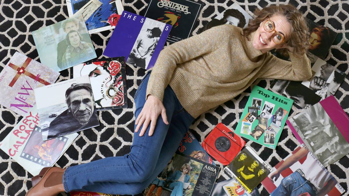 Jo Pybus at home with some of her old vinyl albums. She is one half of a new podcast, Alex the Seal. Picture: James Croucher