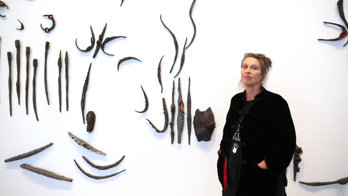 Penny Evans with her artwork titled Gudhuwali at the fourth National Indigenous Art Triennial at the National Gallery of Australia. Picture: James Croucher