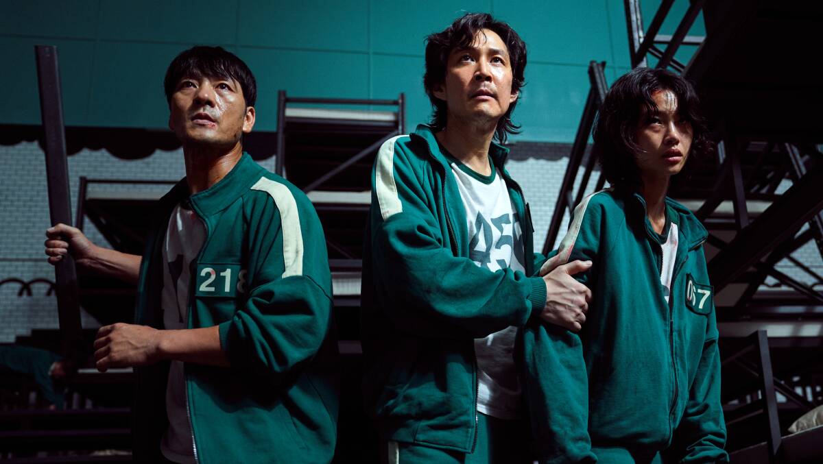 Lee Jung-jae, Park Hae-soo and Jung Ho-yeon in Squid Game on Netflix. Picture: Netflix