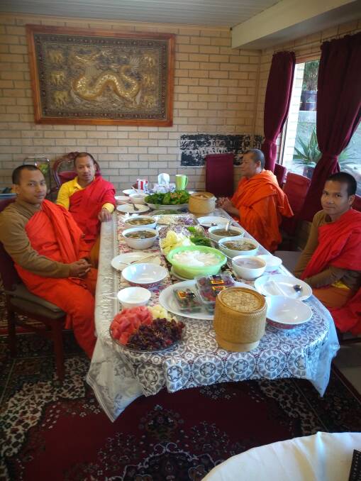  Monks at Wat Lao Buddhanimit in Kambah before lunch. Picture: Jim Laity