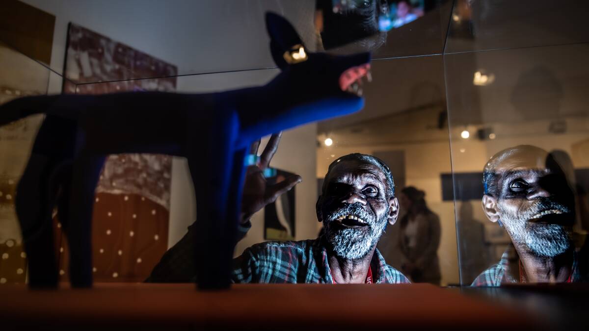 Artist Lex Namponan with his sculpture, Blue Ku' (Dog), in the National Museum's new exhibition, Belonging. Picture by Karleen Minney