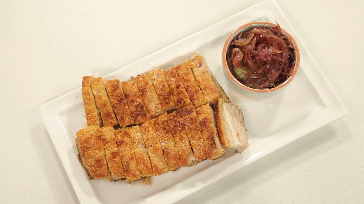 Crispy pork belly roast with onion chutney. Picture: Supplied