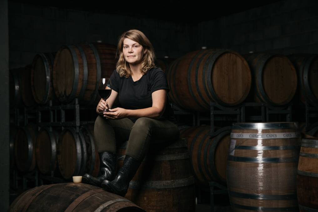 Lake George Winery owner Sarah McDougall with some of the barrels of Edgar's Press. Picture: Supplied