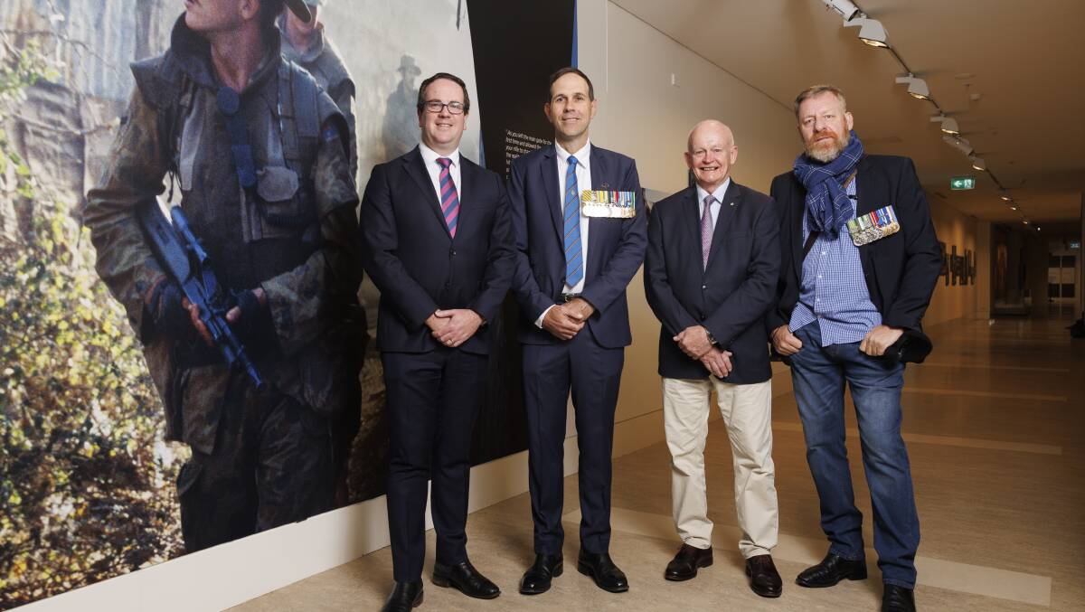 Minister for Defence Personnel and Minister for Veterans' Affairs Minister Matt Keogh, veteran Major Bob Worswick, Australian War Memorial national collection assistant director Brian Dawson and war photographer Gary Ramage. Picture by Keegan Carroll