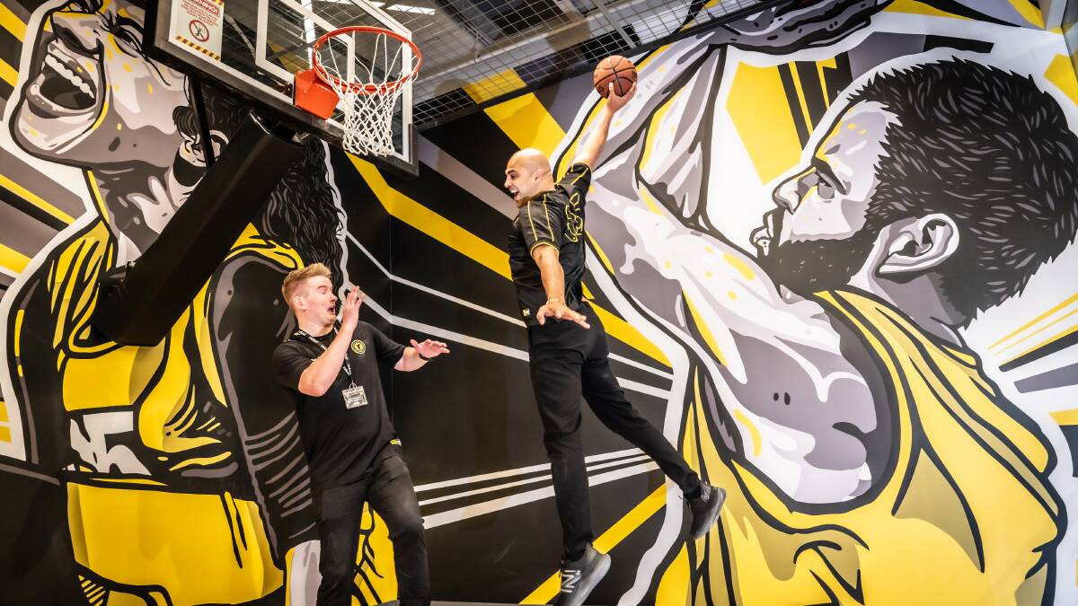Rebel team members Wyatt Hansen and Danny Lattouf try out the basketball space at Canberra's new store. Picture by Karleen Minney 