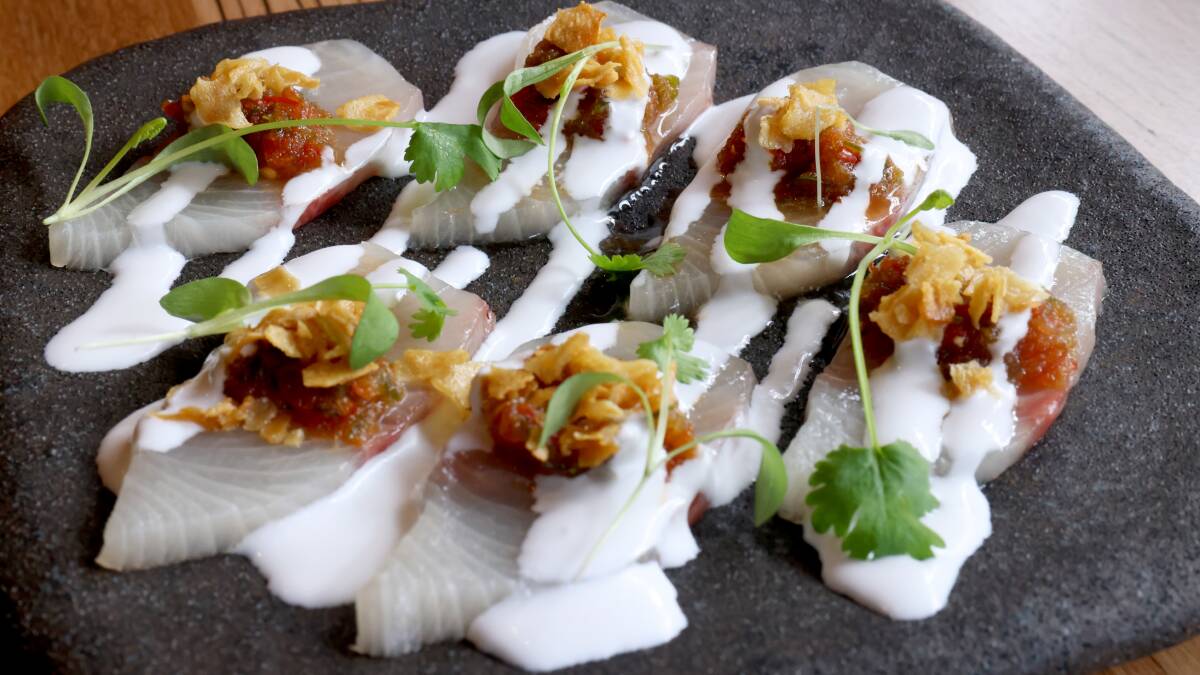 Kingfish sashimi with coconut, nam jim and coriander. Picture: James Croucher