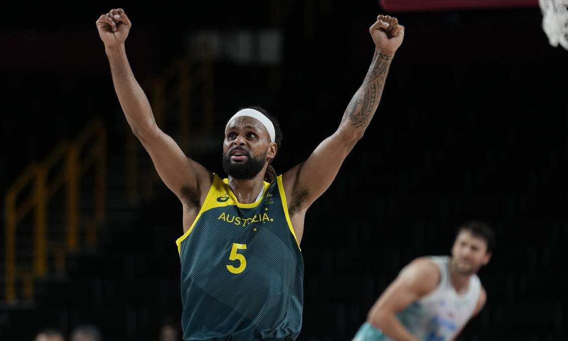 Patty Mills celebrates after the Boomers won the bronze medal playoff. Picture: AAP