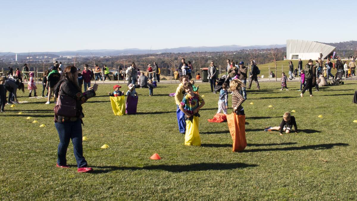 A sack race during Reconciliation Day at the National Arboretum. Picture: Sarah Pabis