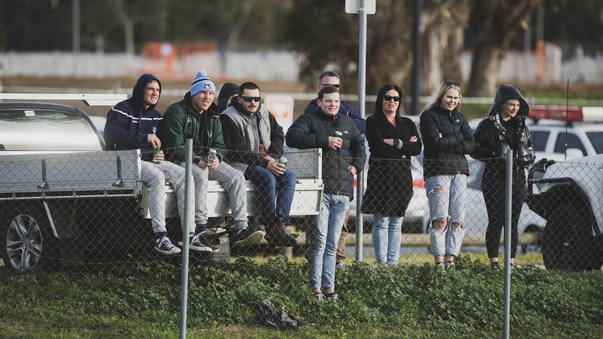 Spectators were forced to watch from outside to adhere to the 100-person limit. Picture: Dion Georgopoulos