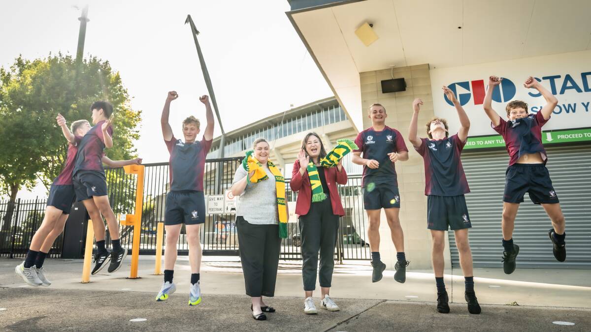 ACT Sport Minister Yvette Berry and Capital Football boss Sam Farrow, centre, with Radford College players at the Socceroos v Lebanon announcement. Picture by Karleen Minney 