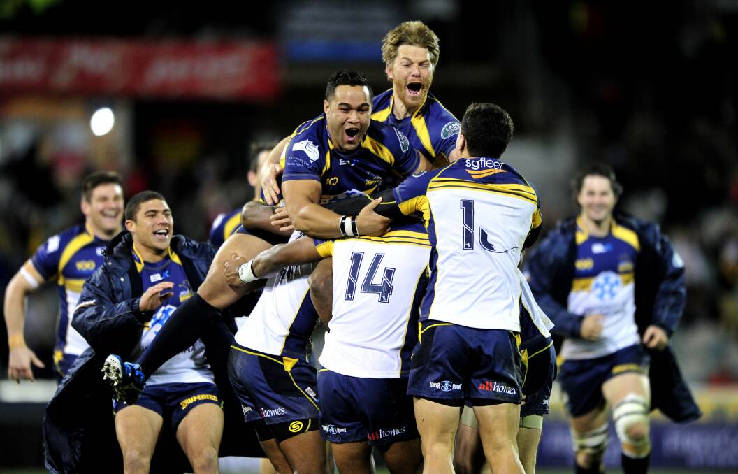 The Brumbies celebrate a win against the British and Irish Lions in 2013. Picture: Melissa Adams