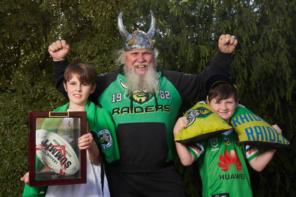 Raiders fans Glen Hodgson, centre, with grandsons Lachlan and Ethan ahead of the NRL semi-final on Friday. Picture: Matt Loxton