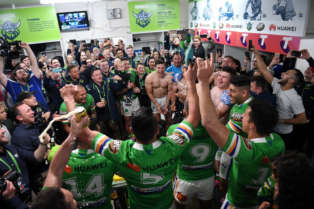 Raiders players celebrate in the sheds after their thrilling win. Picture: NRL Images
