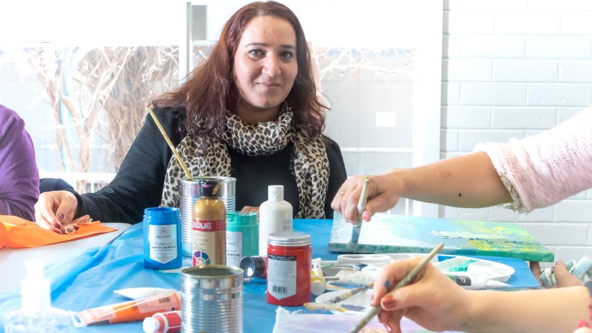 Afghani artist and refugee Hangama Obaidullah runs an art class for migrant women at Weston Creek community centre. Picture: Karleen Minney
