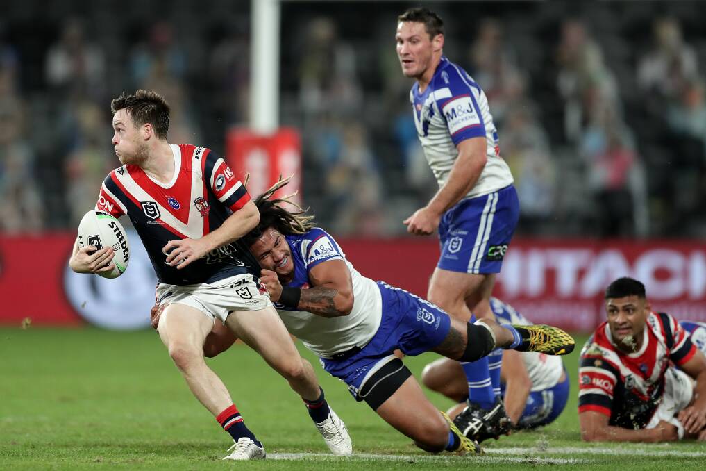 Roosters five-eighth Luke Keary looks for support during the match against the Bulldogs on Monday night. Keary and fullback James Tedesco are finding plenty of room to move under the NRL rule changes. Photo: Mark Metcalfe/Getty Images