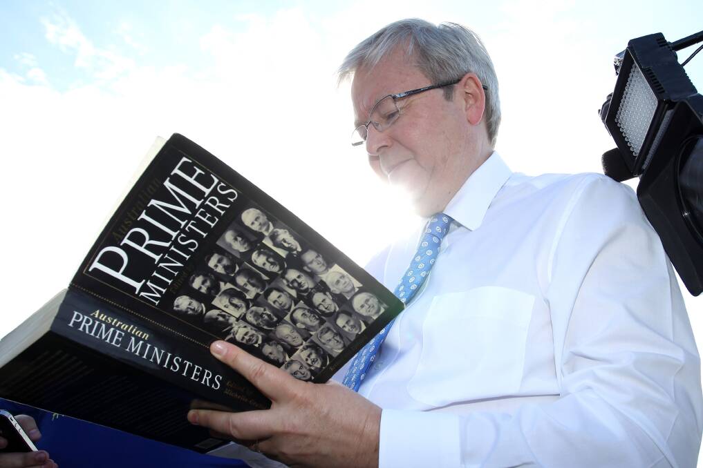 Former Australian Prime Minister Kevin Rudd signs an 'Australian Prime Ministers' book in 2013. Rudd has also written his own revealing book about his government. Picture Getty Images