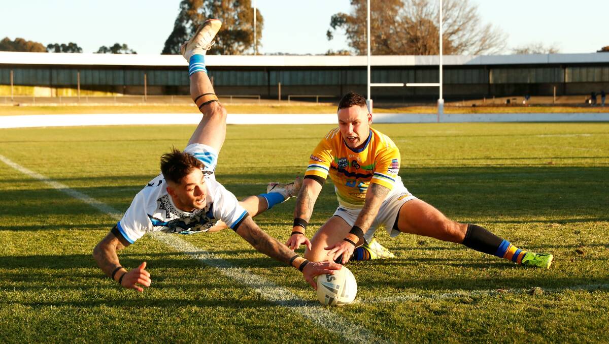 Queanbeyan Blues' Adam Misios dives in the corner to score. Picture: Keegan Carroll
