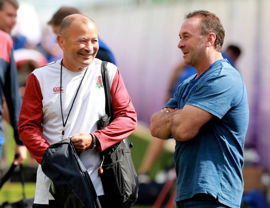 Eddie Jones and Ricky Stuart chat during England's training session on Tuesday. Picture: Getty Images