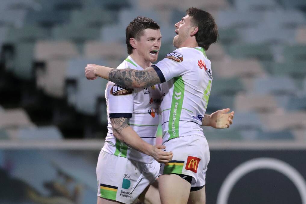 John Bateman and Curtis Scott celebrate one of Canberra's five second-half tries. Picture: Getty Images