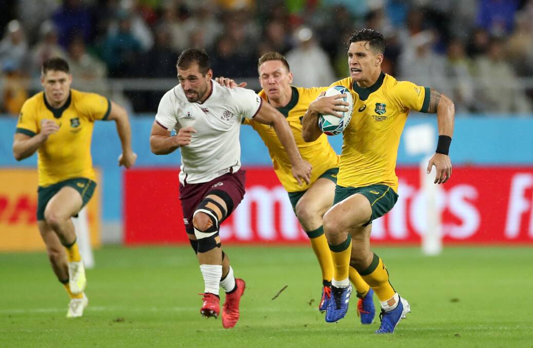 Matt To'omua makes a break for the Wallabies against Georgia on Friday night. Getty Images