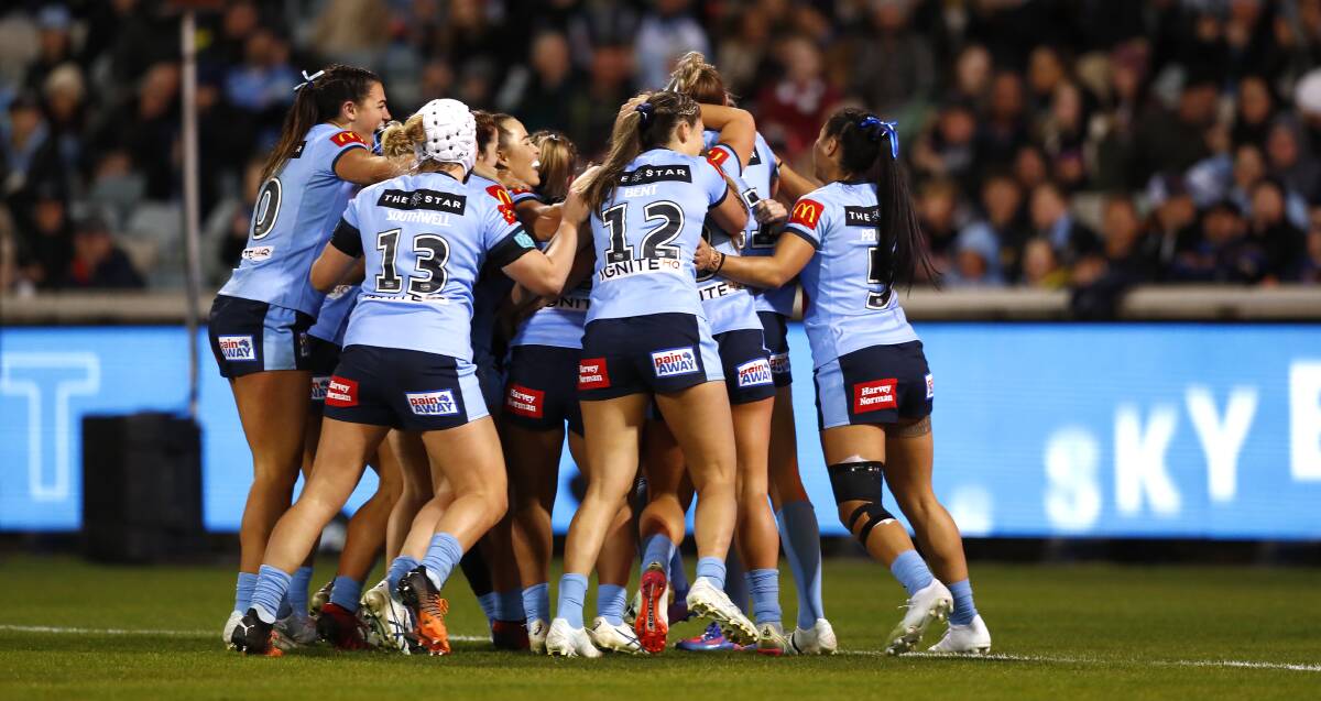 NSW celebrate one of their three tries. Picture: Keegan Carroll