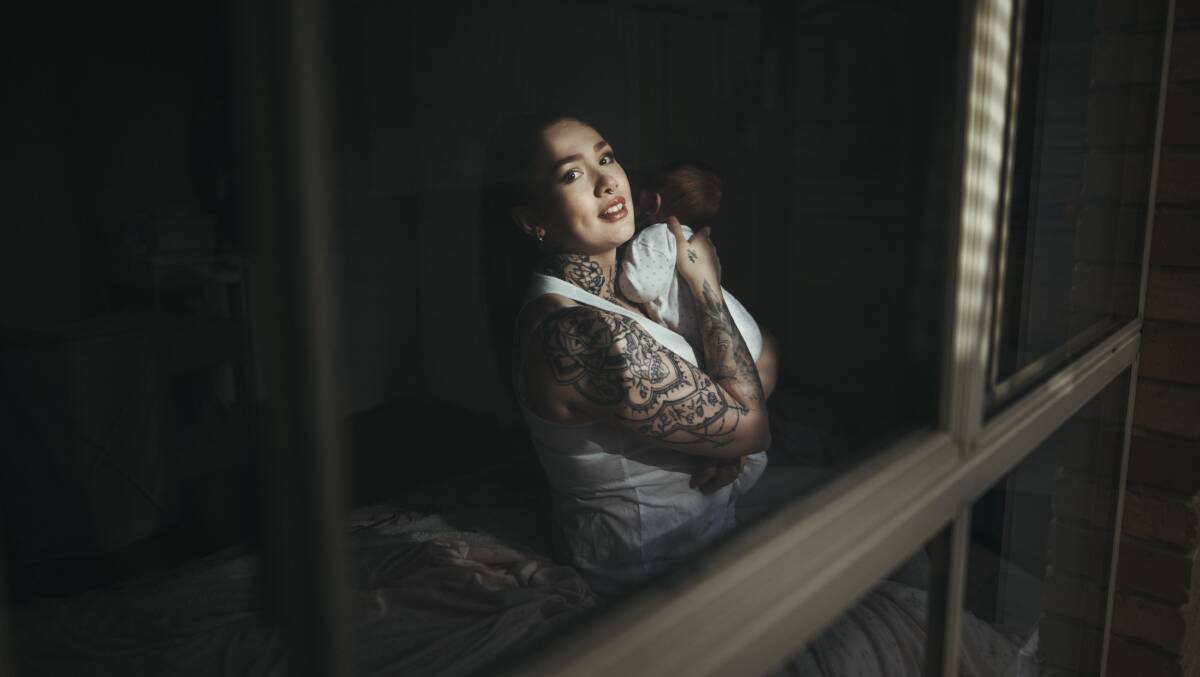 
Owner of Subsdance Dance Studio Charlie Wan, which was listed as an exposure site, pictured at her home in Ngunnawal with her newborn daughter Luna during lockdown. Picture: Dion Georgopoulos