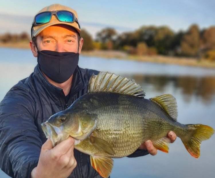 Nathan Walker with a monster redfin caught in a local waterway.