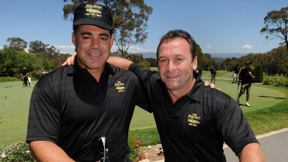 Stuart with great mate Mal Meninga. The pair coached against each other in the 2011-12 State of Origin series. Picture: Richard Briggs