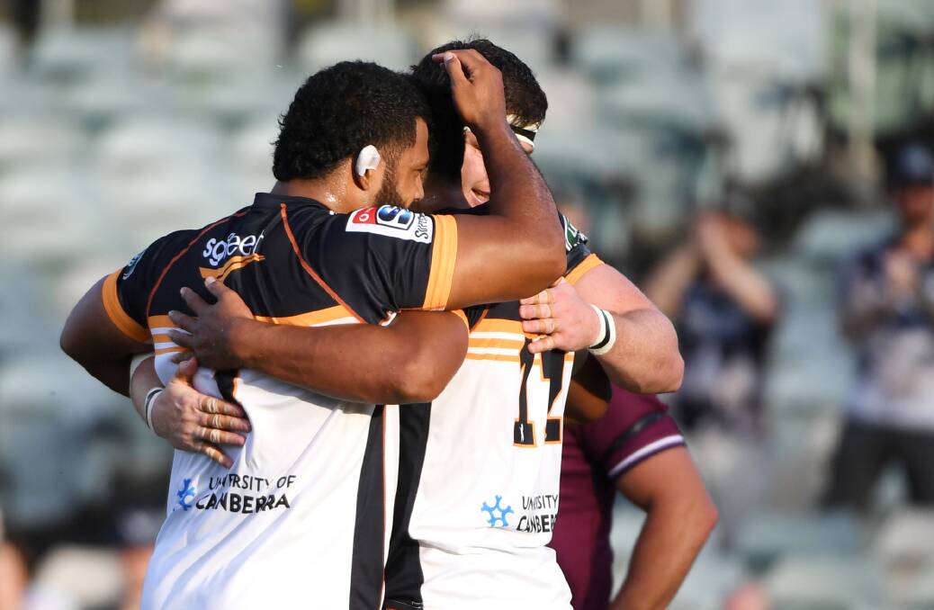 Brumbies players celebrate a try. Picture: Getty Images