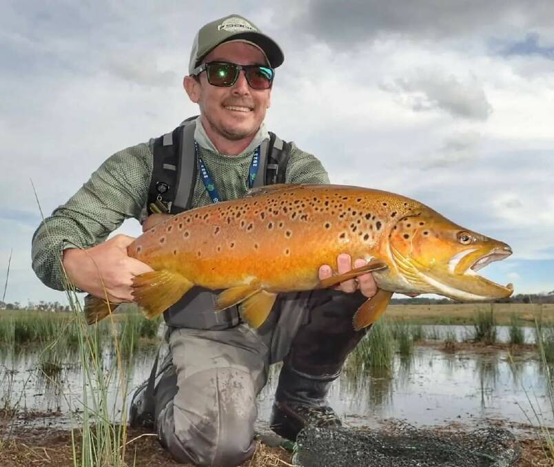 Nathan Walker with a monster pre-spawn run brown trout from Lake Eucumbene.