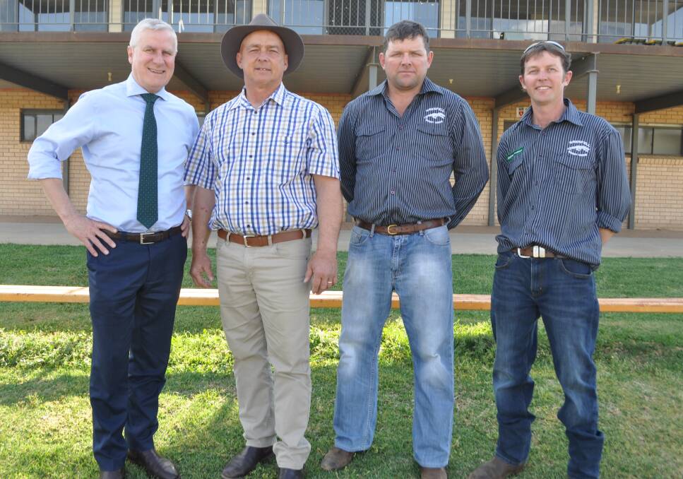 Deputy Prime Minister Michael McCormack visiting the Weddin Shire Council to welcome drought spending on the local rugby oval. From left, Mr McCormack, Mayor Mark Liebich, and rugby club president Mark Hughes and secretary Joshua Taylor. Picture: Olivia Calver