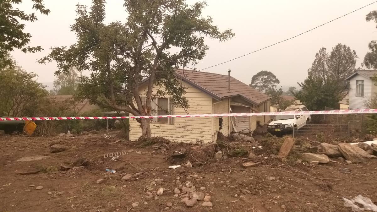 A house on Orana Avenue that might have been displaced from his foundations by the Cooma town water tank that burst on Saturday night. Picture: David Roncelli