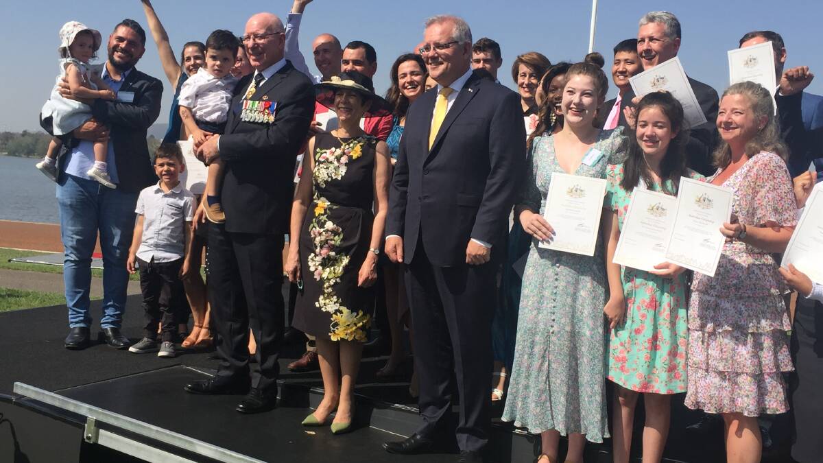 Scott Morrison and Governor-General David Hurley with new citizens in Canberra on Sunday. Picture: Kirsten Lawson