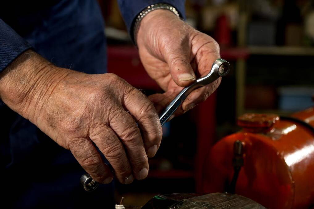 Brian Phllips's craftsman's hands bring machines back to life. Picture by Phillip Biggs