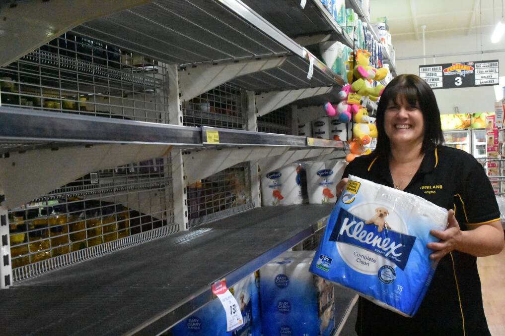 BIG DEMAND: Mid North SA Foodland staff member Jayne Lovell with one of the few toilet paper options left in store this week. Photo: Chelsea Ashmeade