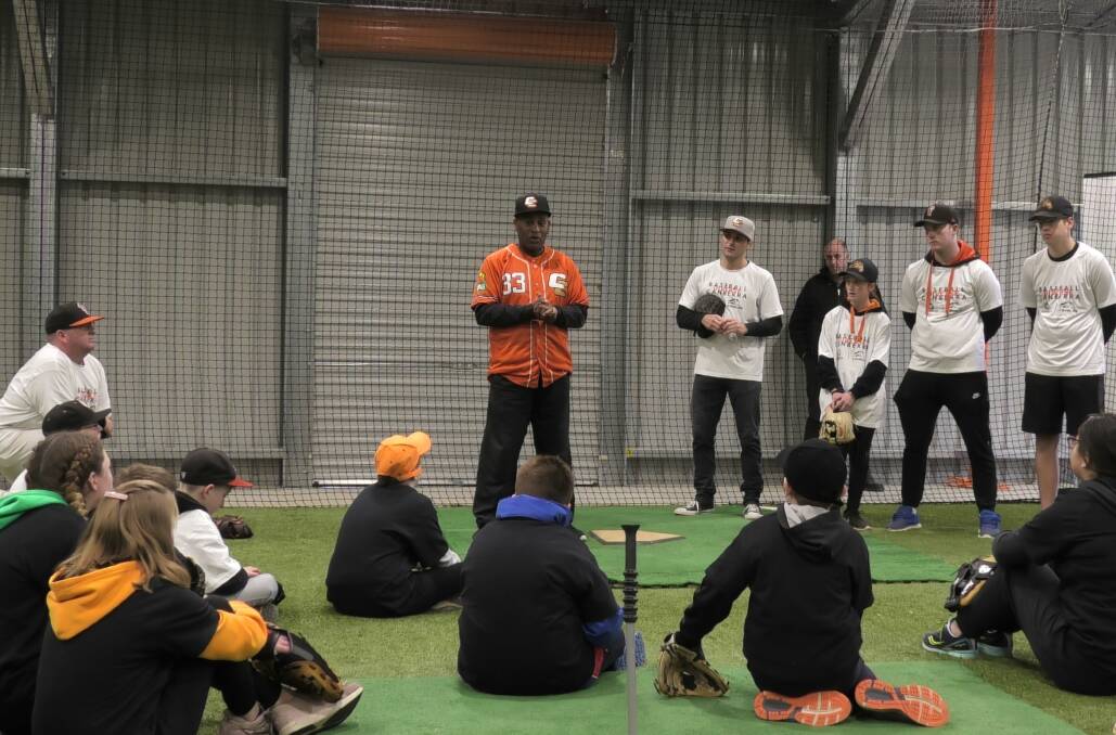 Cal Bruton talks to kids at Diverse baseball Canberra clinic. Photo: Ben Moore