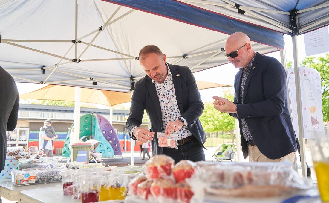 Andrew Barr buying some cakes from the North Ainslie Primary School stall on election day. Picture: Matt Loxton