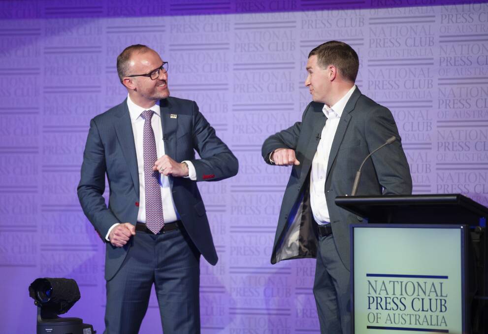 ACT Chief Minister Andrew Barr and Opposition Leader Alistair Coe exchange an elbow bump after their debate. Picture: Sitthixay Ditthavong 