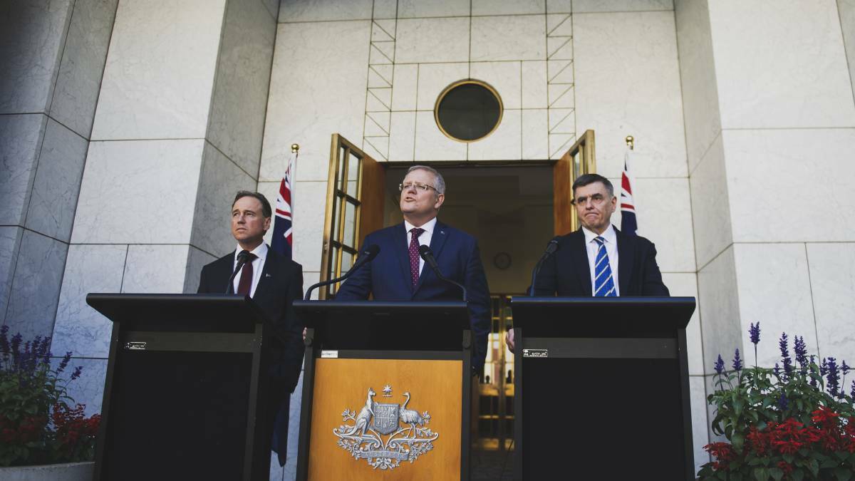 Prime Minister Scott Morrison, with Health Minister Greg Hunt, left, and Chief medical office Brendan Murphy, right. Picture: Dion Georgopoulos