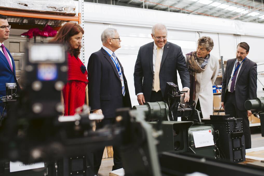 Prime Minister Scott Morrison with the Liberals' Eden-Monaro candidate Fiona Kotvojs, and CEO of Electro Optics Systems Ben Greene. Picture: Jamila Toderas