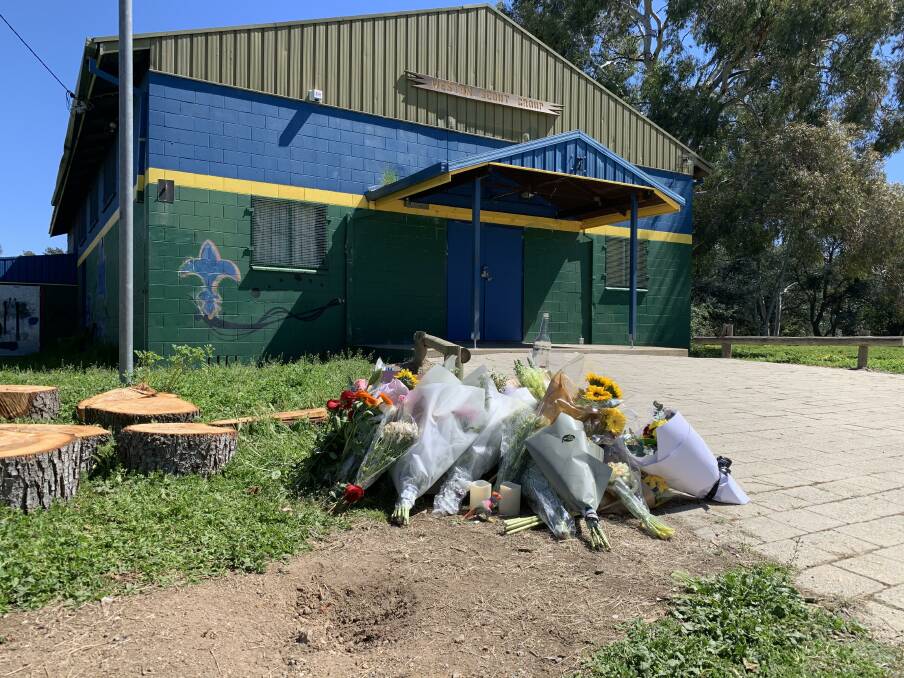 Flowers at the stabbing scene. Picture: Peter Brewer