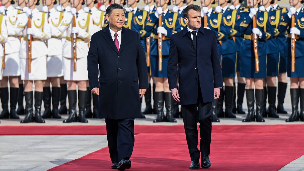 French President Emmanuel Macron was welcomed to China by Xi Jinping to much fanfare. Picture Getty Images