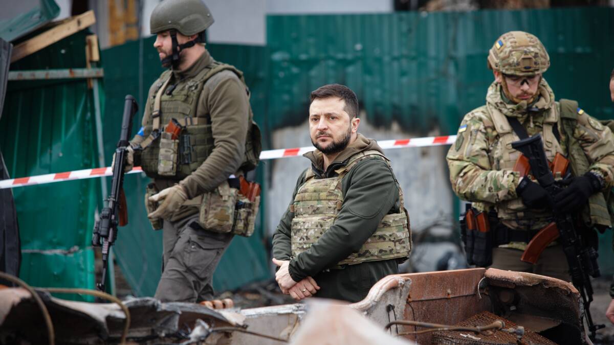Ukrainian President Volodymyr Zelenskyy, right, in Bucha after the town's liberation from Russia in 2022. Picture Shutterstock