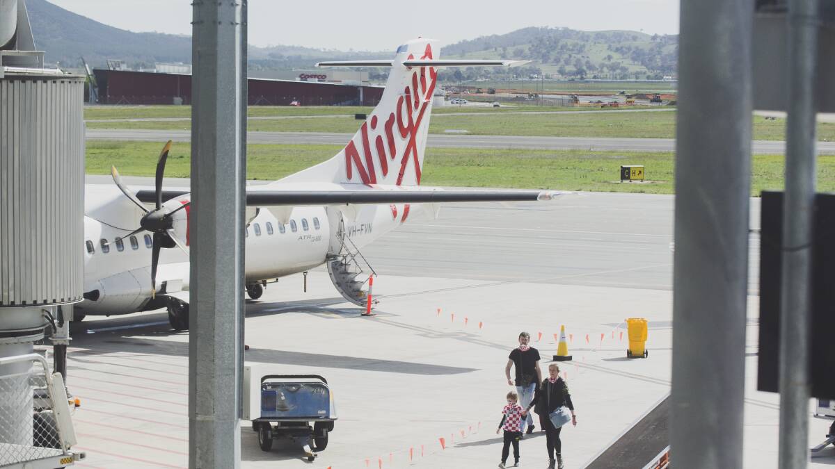A Virgin plane waiting on the tarmac at Canberra airport. Picture: Dion Georgopoulos