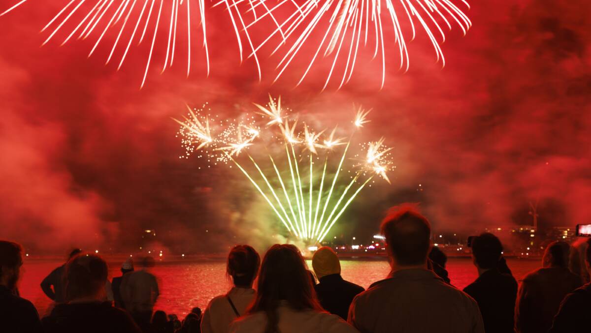 Thousands gathered by Lake Burley Griffin for a spectacular fireworks display. Picture by Keegan Carroll