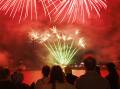 Thousands gathered by Lake Burley Griffin for a spectacular fireworks display. Picture by Keegan Carroll