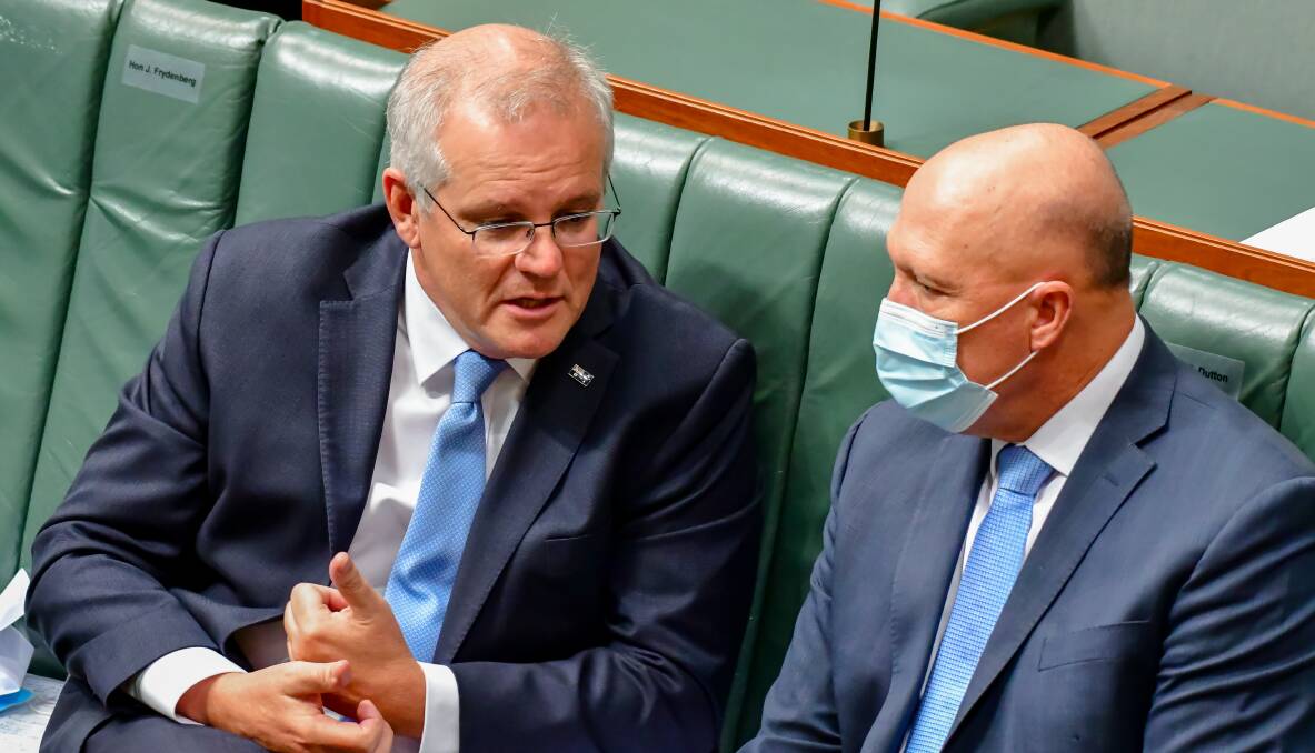 Prime Minister Scott Morrison and Defence Minister Peter Dutton, the latter of which suggested using public money to help politicians sue for defamation. Picture: Elesa Kurtz