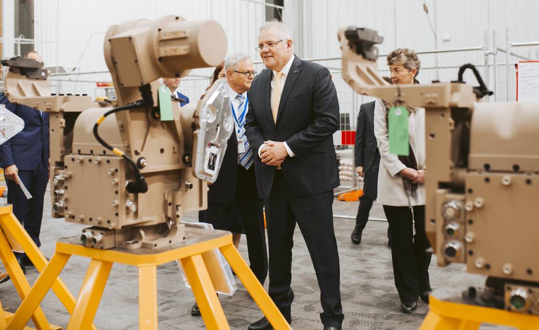 Prime Minister Scott Morrison visits Canberra-based defence and space technology manufacturer EOS Group following the announcement of increased military spending. Picture: Jamila Toderas