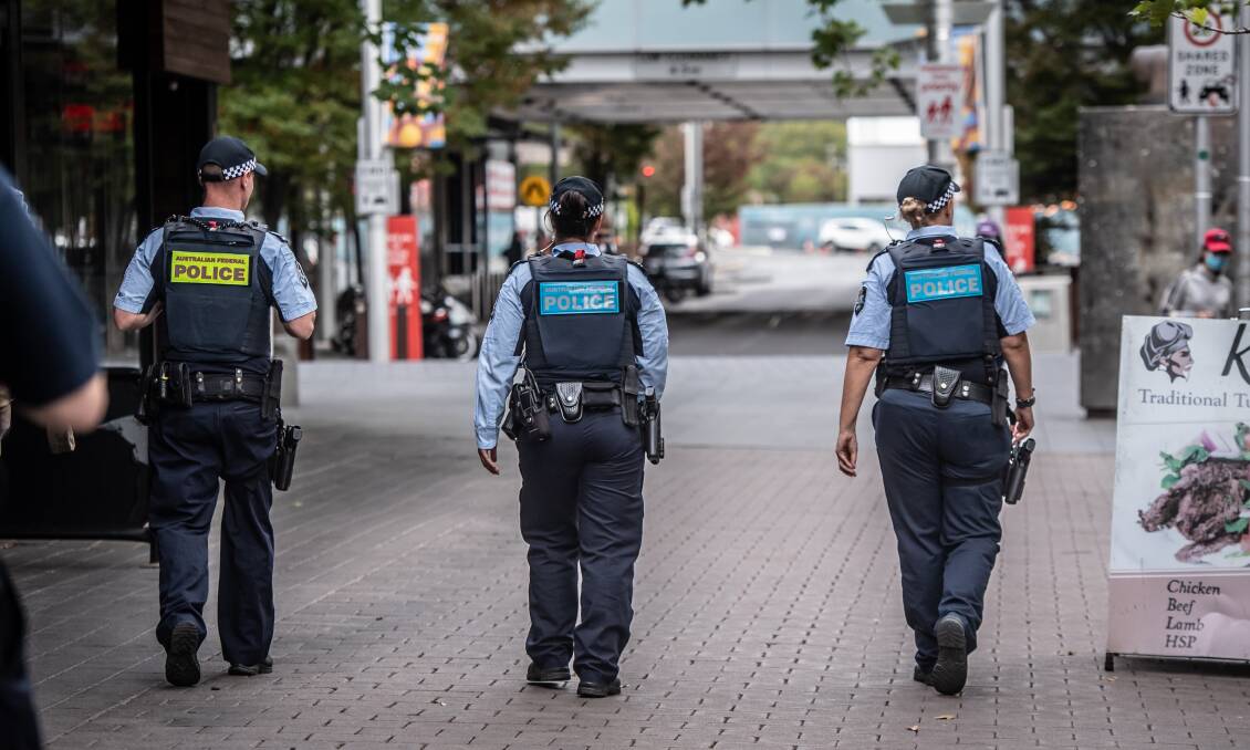 AFP officers patrol Canberra's empty streets earlier this week. Picture: Karleen Minney